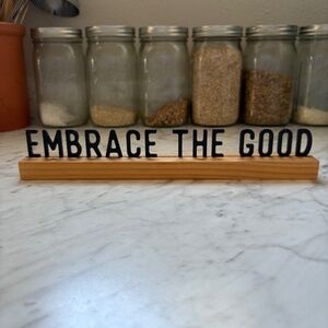 "Embrace The Good" sign